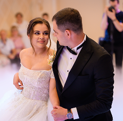 side view pretty woman white gown with deep neckline looking groom which wearing elegant black suit bow 1